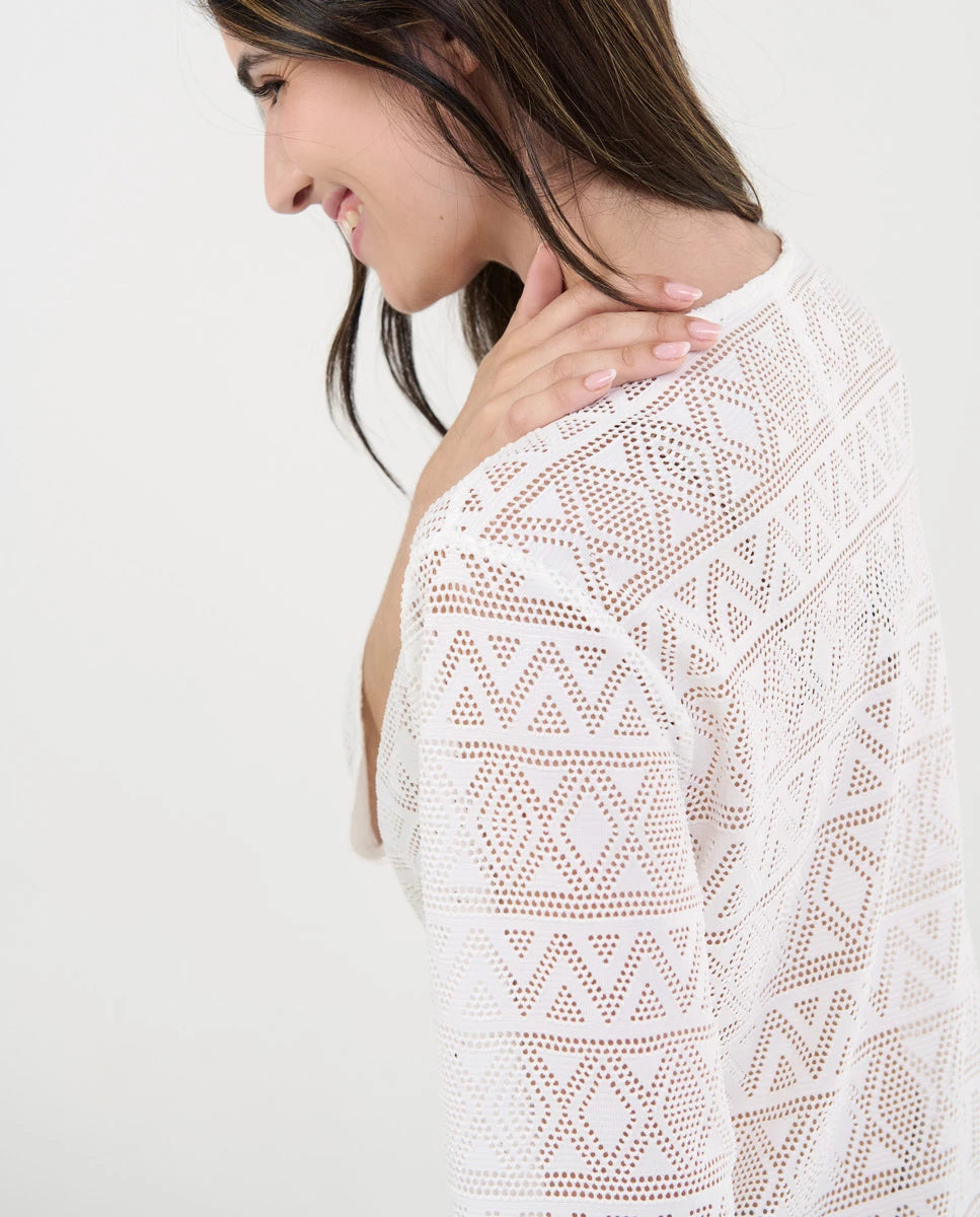 Vestido de baño de mujer corto negro con manga en punto desagujado motivos geométricos con cuello pico.