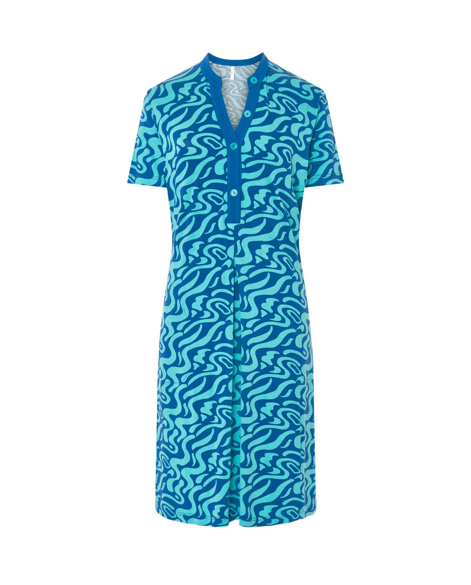 Vestido de baño corto de manga corta en punto azul con estampado ondas, cuello abierto con pata y bolsillos laterales